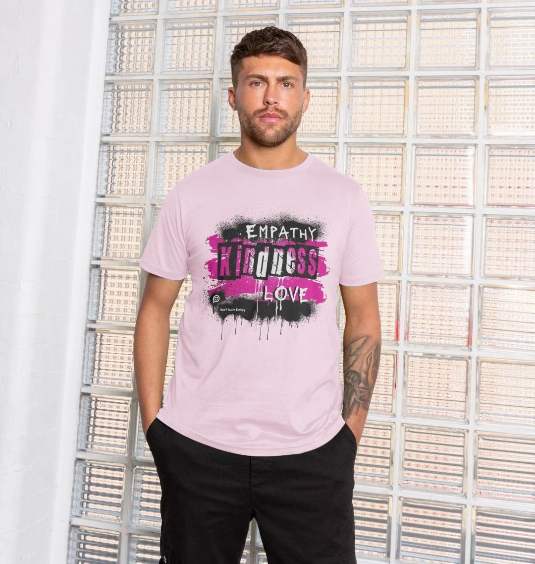 Male model wears baby pink t-shirt with the bright pink design for the heart chakra energy t-shirt with the words - Empathy, Kindness, Love to the front in a bold grafitti style font.