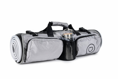The Roo betty Orla Yoga Mat bag has a comparment for water bottle and 2 zipped pouch pockets for yoga strap or socks