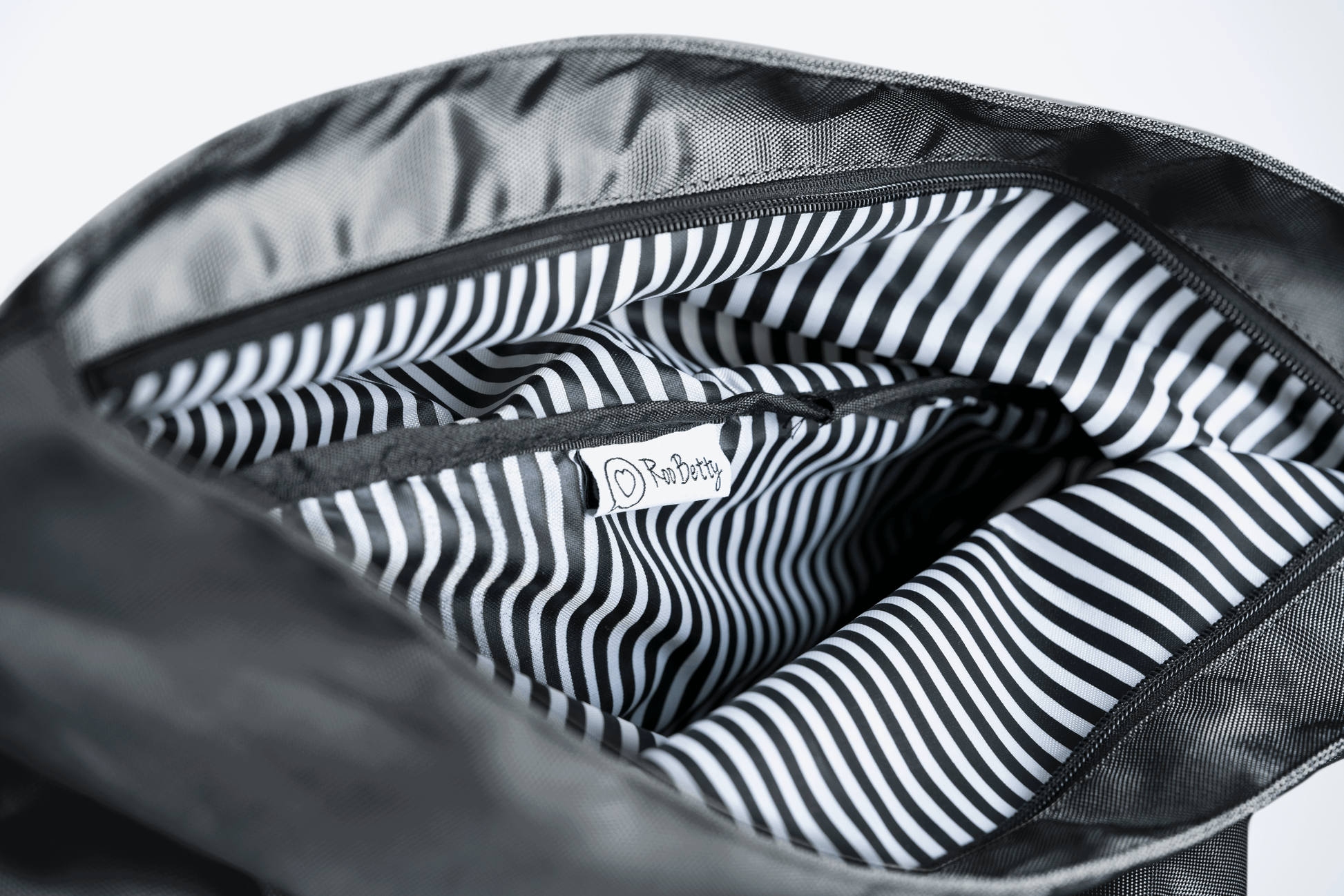 Roo betty signature striped lining on the nyx roll top back pack - shower proof