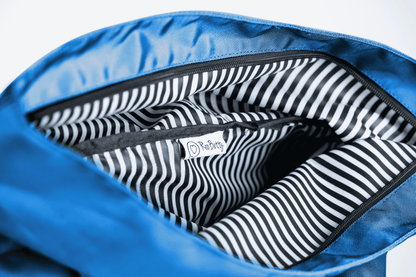 The Roo betty Nyx Back pack has a black and white striped lining which makes it shower proof