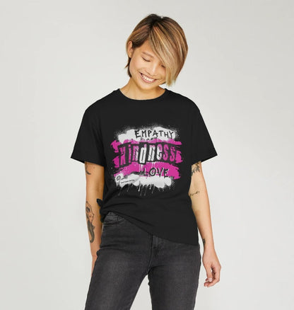 female model wears the relaxed fit t-shirt in black with the pink heart chakra energy design 